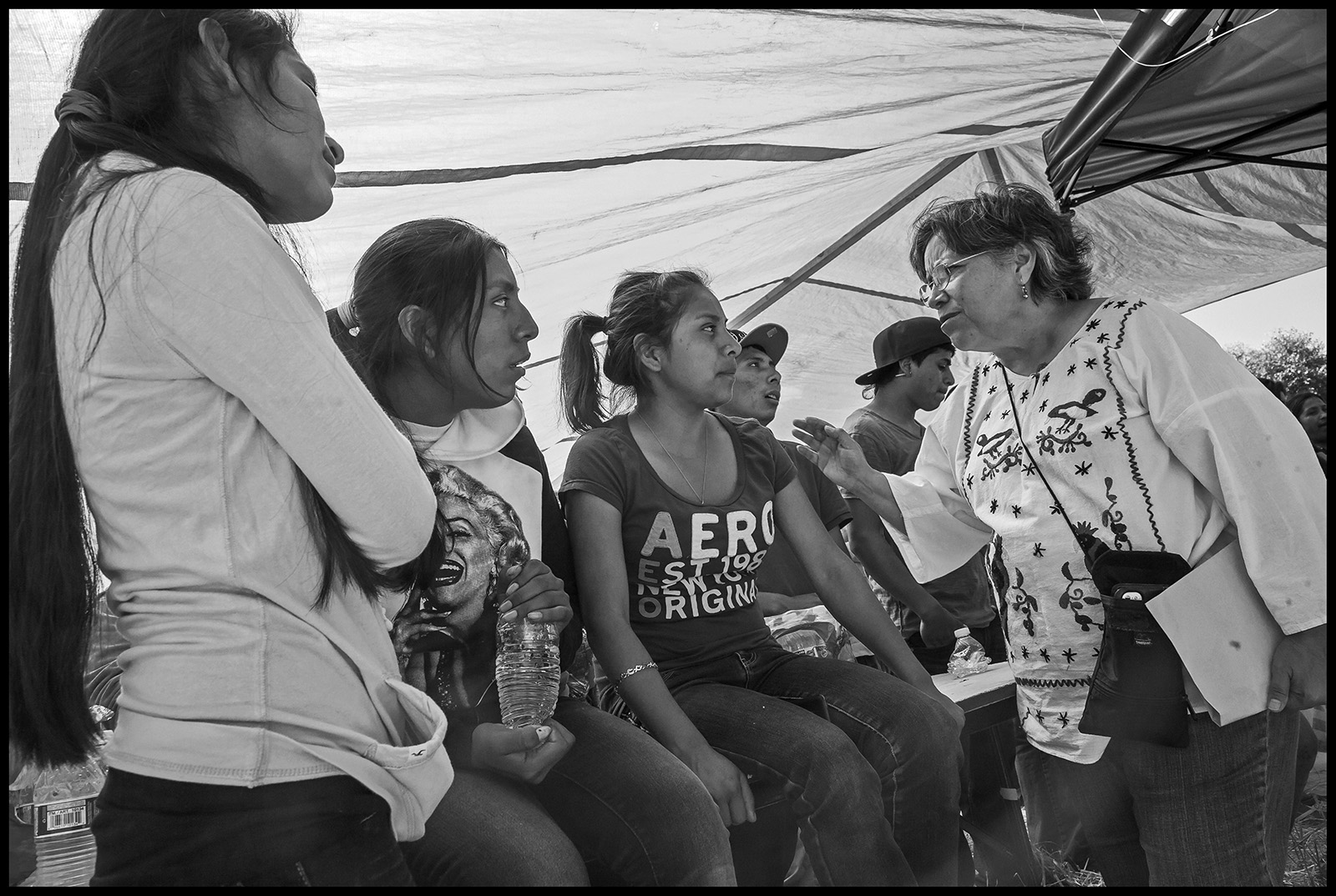 organizer talks to farm workers