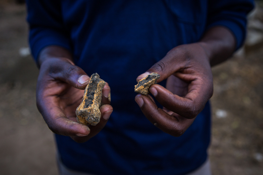 miner holding pure cobalt