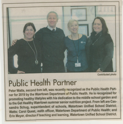 newspaper clipping of teacher winning public health award