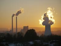 Image: factory smokestacks and smog. Topic: Dirty energy.