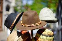 Image: rack of hats. Title: Time Banks and Bartering: Get What You Need Without Money