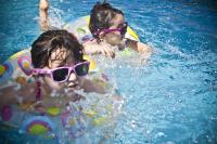 two kids swimming