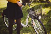 woman holding a bike