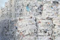 Image: huge bales of paper trash. Topic: Why Recycled Paper?