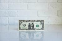 Image: one dollar bill. Topic: How a $25 Small Loan Can Change the World 