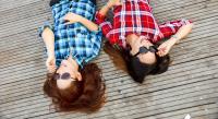 Two women with plaid shirts via Pexel