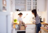 mom and daughter in kitchen (istock)