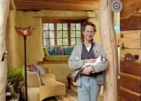 Bill Hutchins with his cat in his sunroom