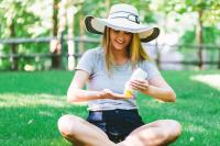 girl putting on sunblock