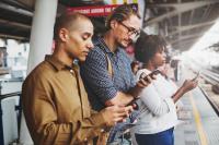 Image: three people using mobile phones. Title: Verizon Racing Towards 5G But Ignoring Clean Energy