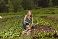 Photo of author with her dog on the farm.