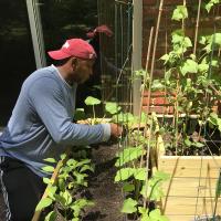 Image: Monique's father in his garden. Title: Finding Hope for Climate in My Parents' Garden