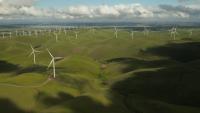 Image: wind turbines on green hills. Title: Clean Energy Victory Bonds