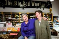 Julie Paez and Pennye Jones-Napier in their store, the Big Bad Woof, laughing