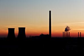 Coal and nuclear plants at night