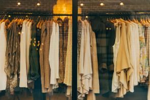 Image: clothing hanging on a store rack. Title: Carter's Responds to Calls to Remove Toxic Chemicals from Baby Clothes, Improve Sustainability Practices