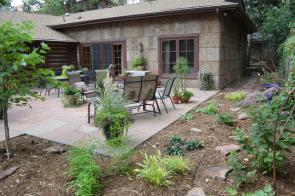 Log cabin remodel and addition. Note the natural tree bark siding.