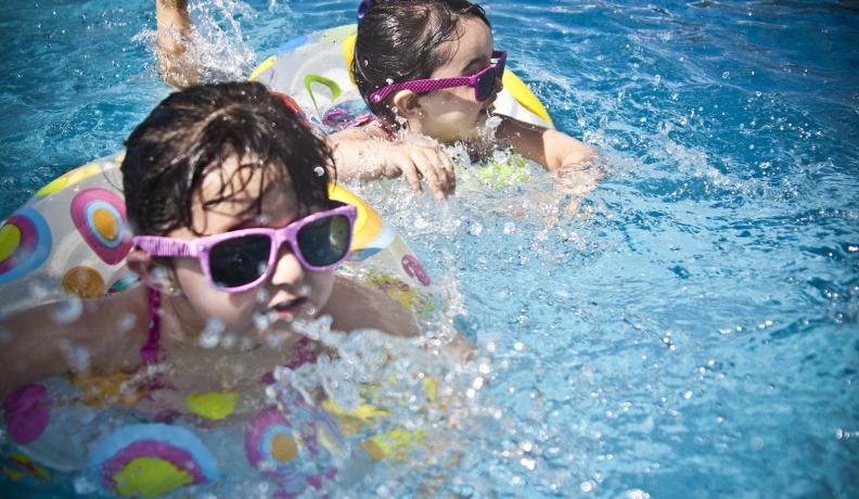 two kids swimming