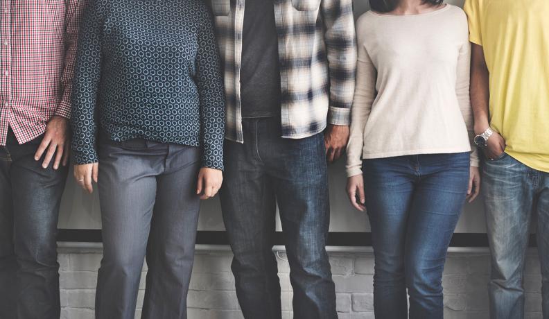 Image: people lined up in different outfits. Topic: 7 Tips for Less Toxic Clothing