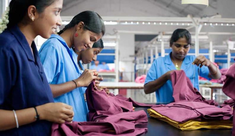 Image: women working with textiles. Title: In Search of Ethical Fashion