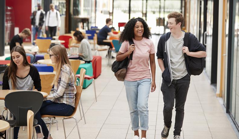 students chat together in a common area