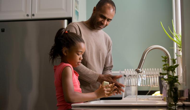 father and daughter handwashing 