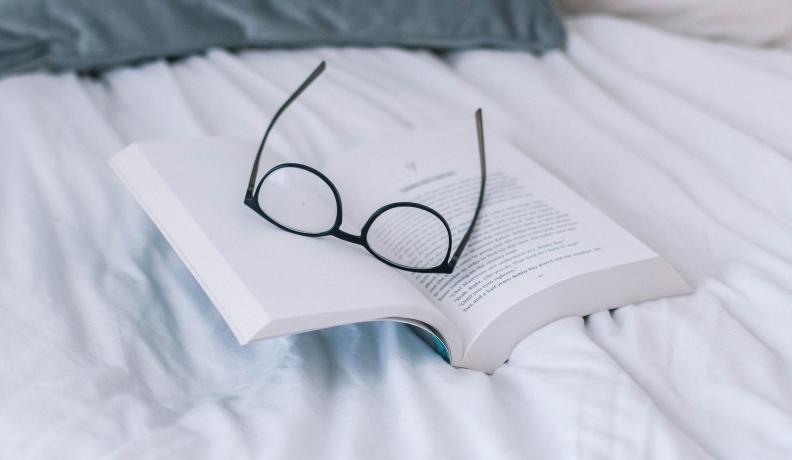 eyeglasses on a book