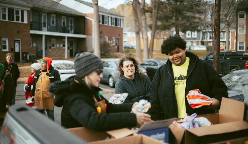 Gifts being delivered in the back of a truck to underserved communities. Photo by Samuel Peter.