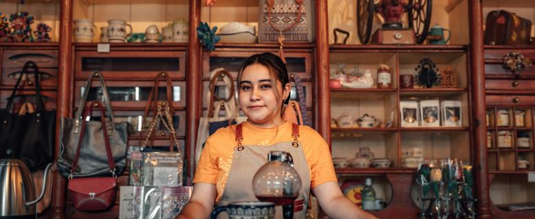 A latina woman in a shop in Lerma da Villada, Mexico. latino/a-owned