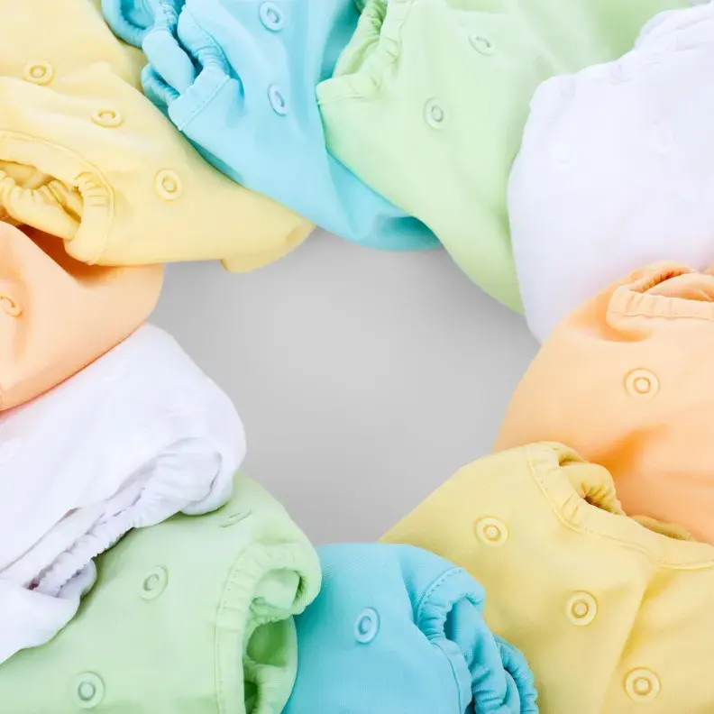 Image: colorful array of cloth diapers. Topic: Go Green With Cloth Diapers