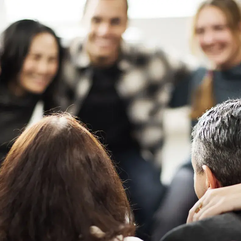 Image: group of diverse people in circle. Topic: 10 Ways to Build Community