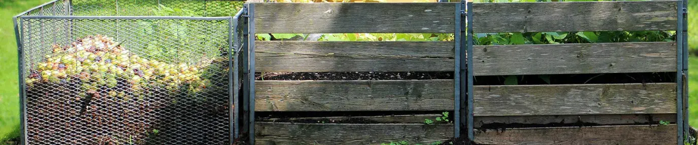 Image: compost bins in a yard. Topic: Methods of Regenerative Agriculture: #4 Composting