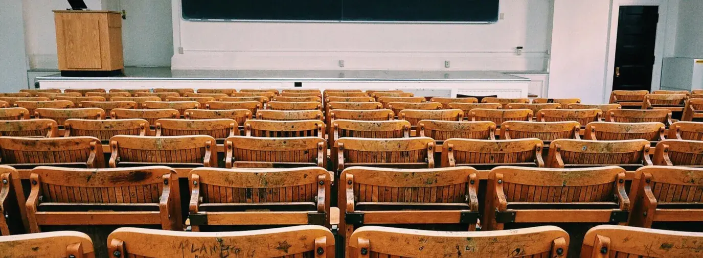 Image: classroom with empty seats. Topic: Greening School Fundraisers