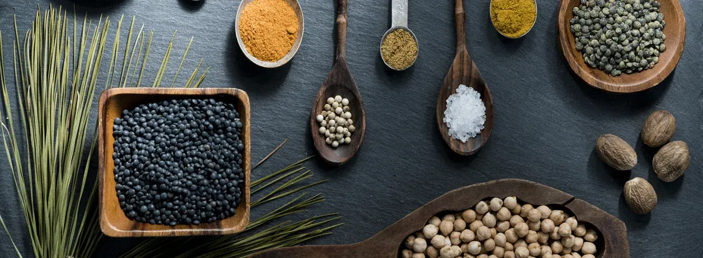 herbs and spoons on a table