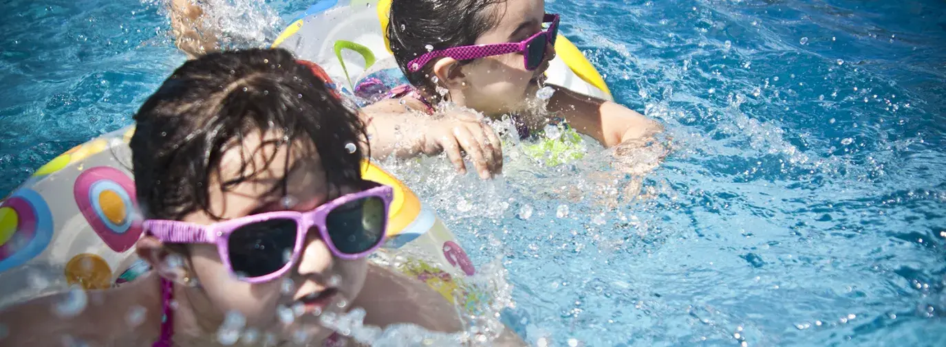 two kids swimming