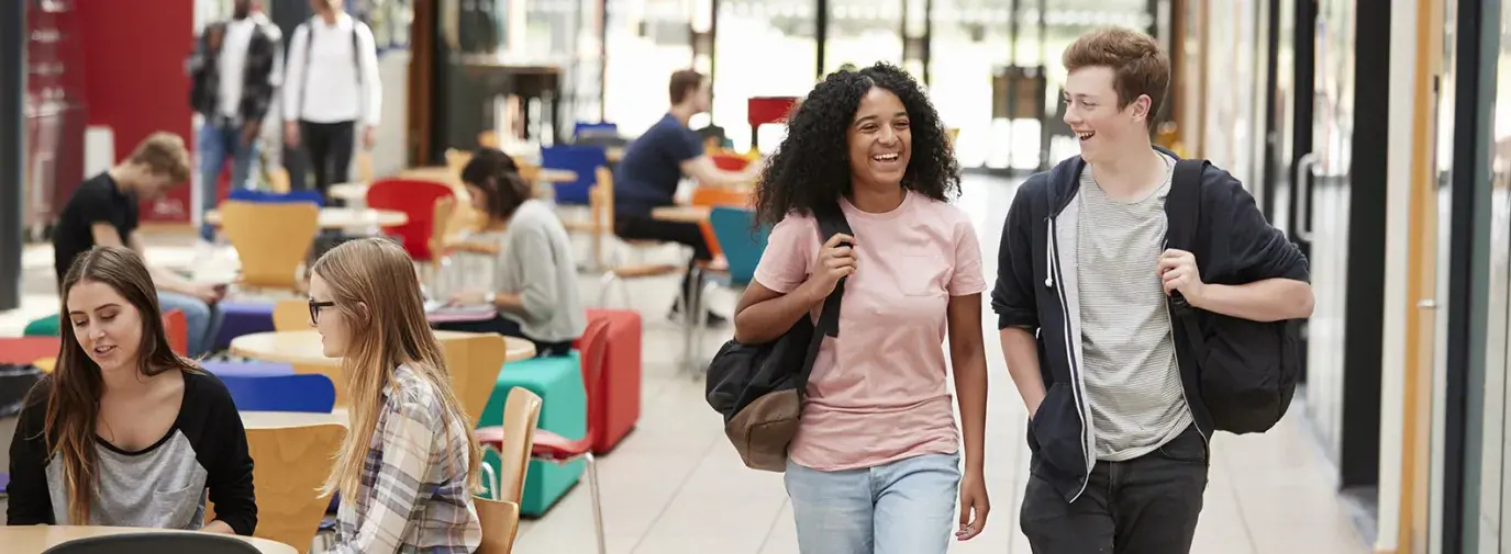 students chat together in a common area