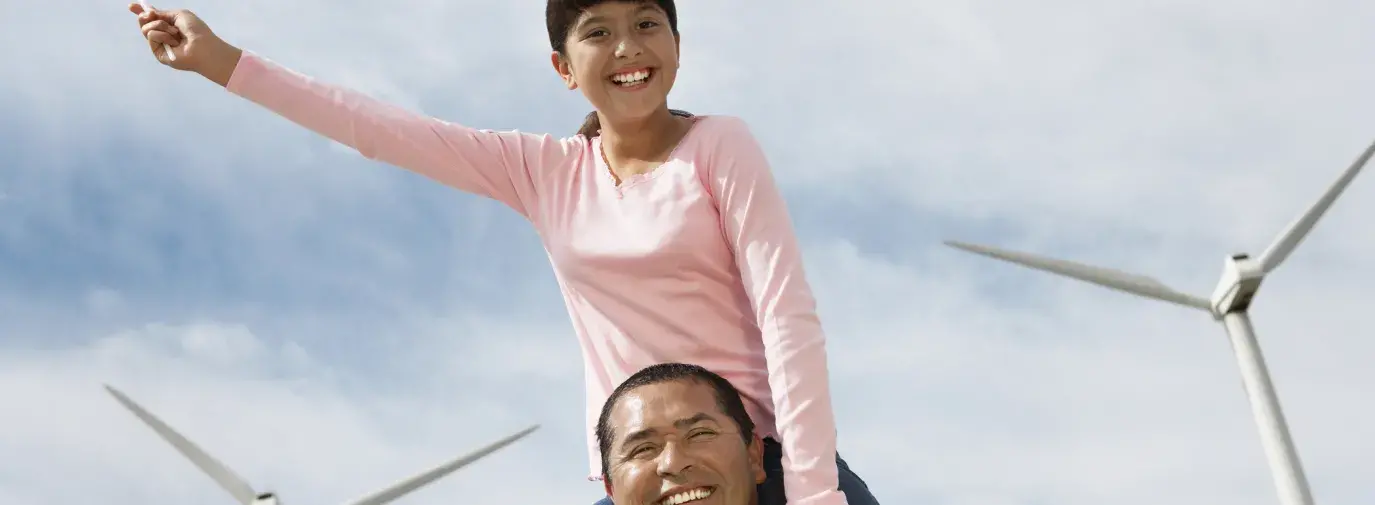 man and girl with windmills