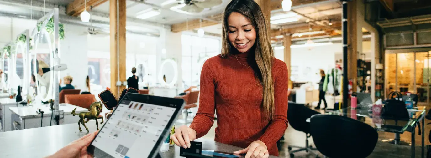 Photo of a customer at a check out counter