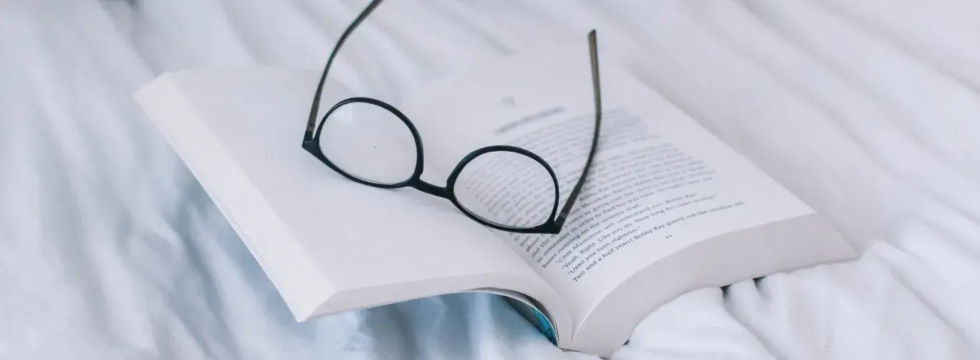 eyeglasses on a book