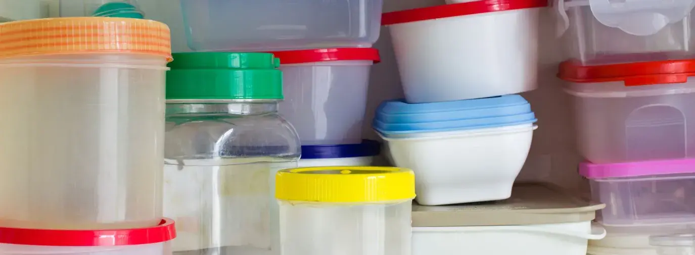 stacks of empty plastic tupperware containers