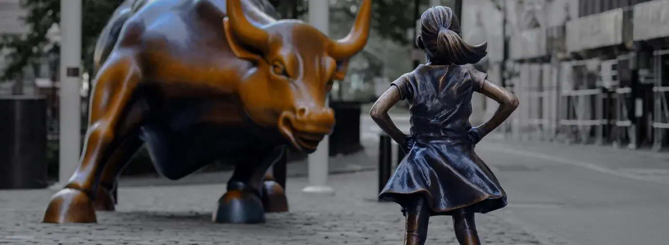 girl in front of bull wall street shutterstock