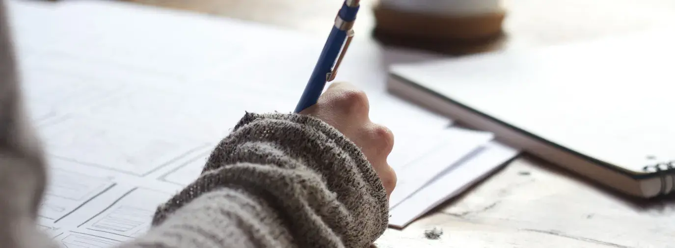 Person writing a letter