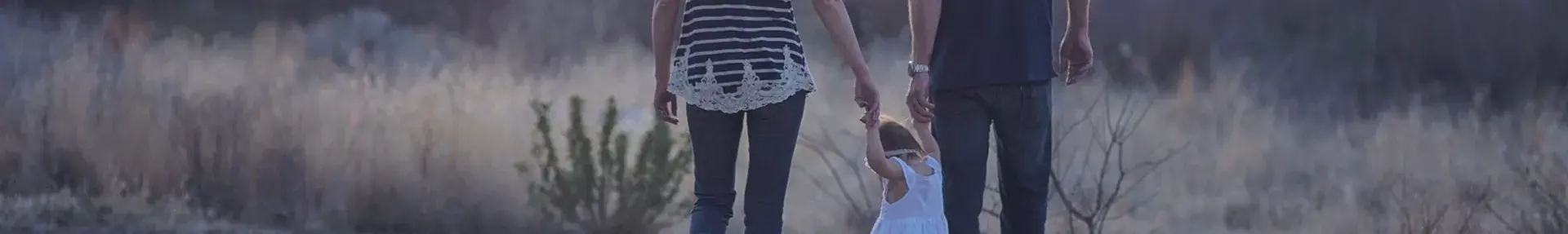 Image: family walking outdoors. Topic: Get involved with Green America.