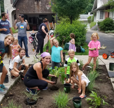 Parents and Children Planting a garden