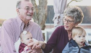 grandparents holding grandchildren