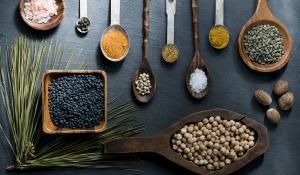 herbs and spoons on a table