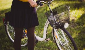 woman holding a bike