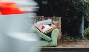 Image: couch and teddy bear left on the sidewalk. Title: How a quest to sustainably unload unwanted stuff led Deron Beal to found Freecycle.