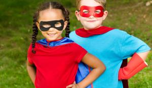 Image: two kids in costumes. Topic: Green Your Halloween: From Organic Candy to Nontoxic Face Paint