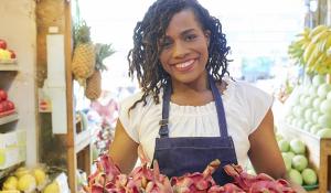 Image: woman with food. Title: Essential agriculture workers need our support during COVID-19